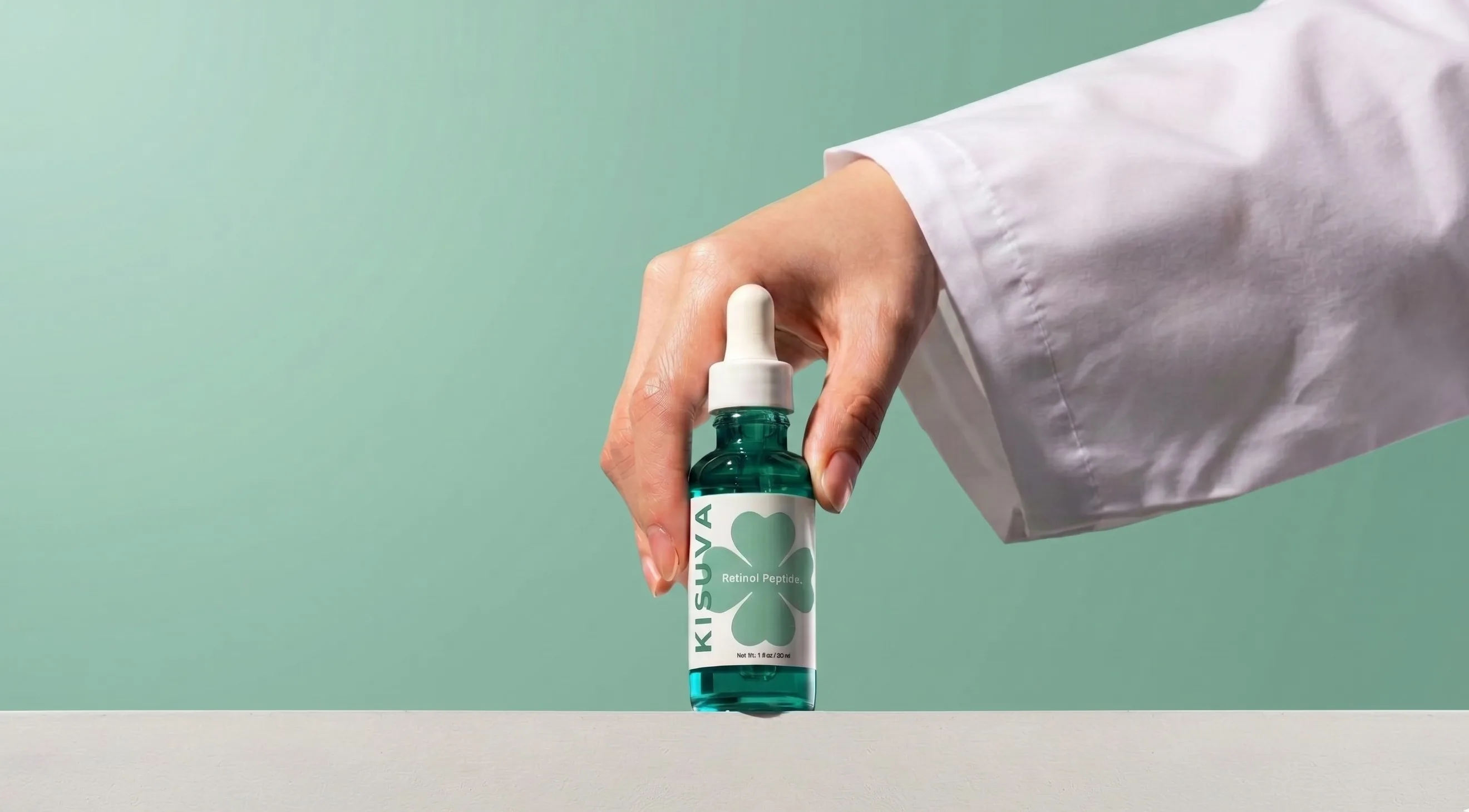 Doctor holding Kisuva Retinol Peptide Serum