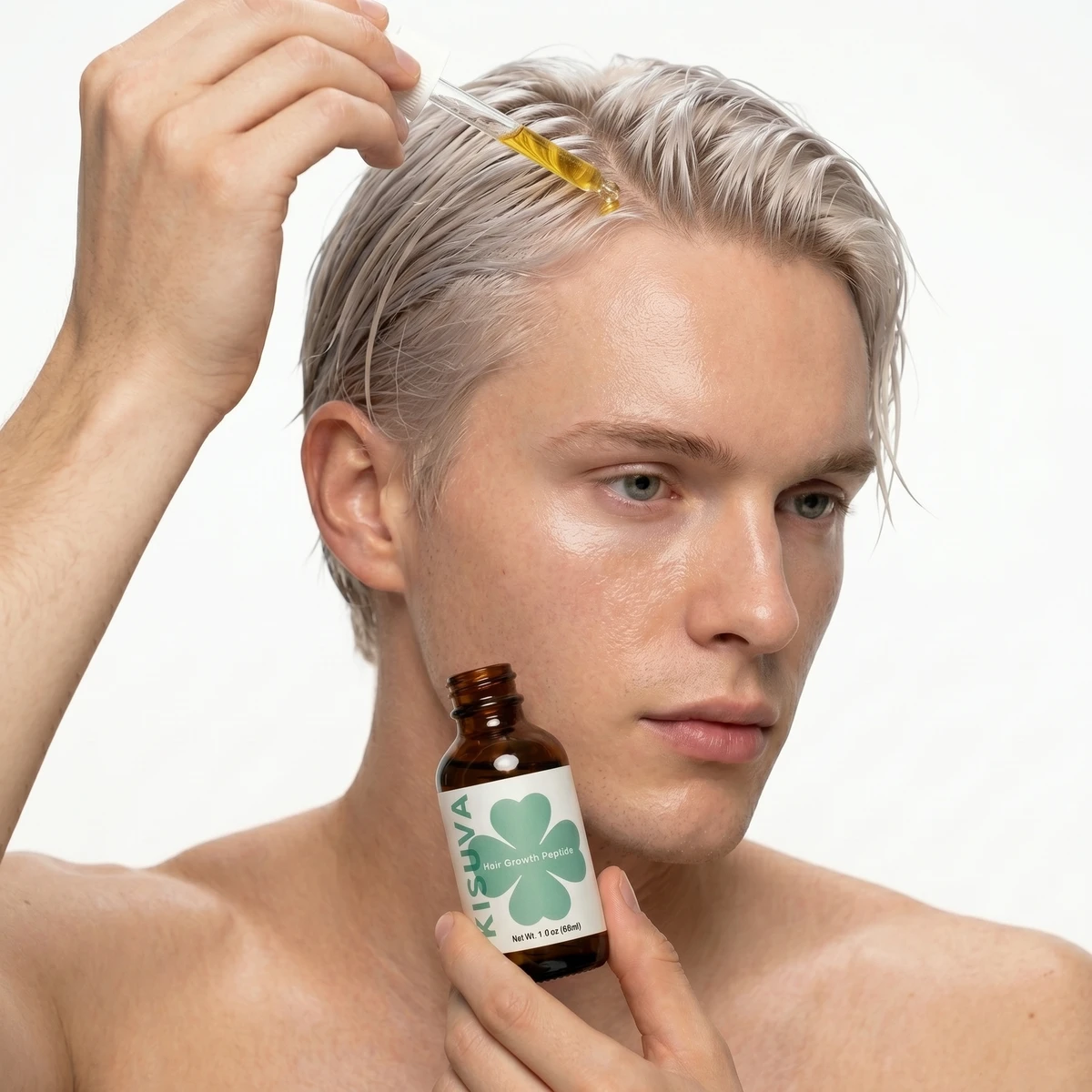 Blonde man applying Kisuva Hair Growth Serum