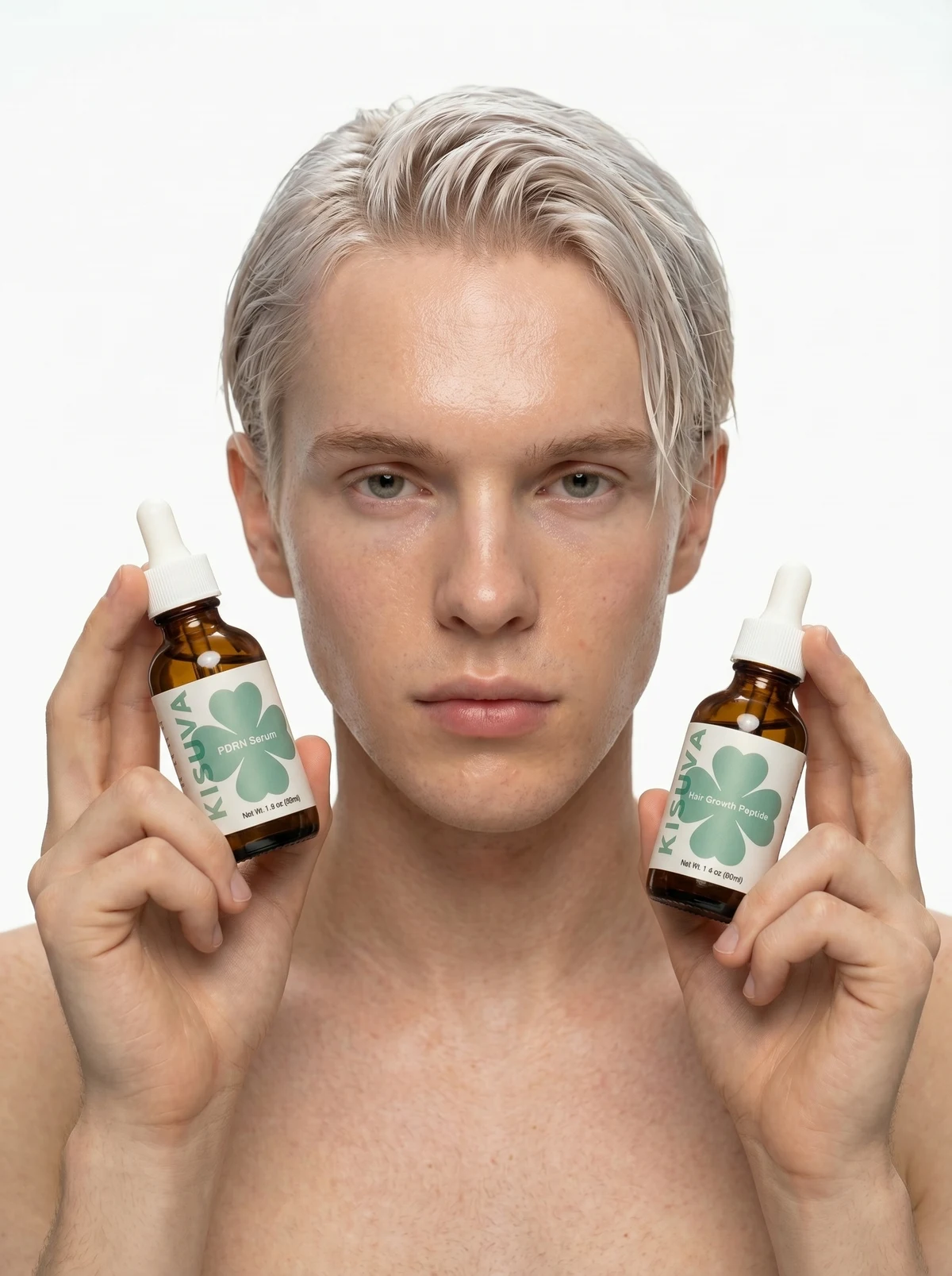 Blonde man holding Kisuva PDRN and Hair Growth serums